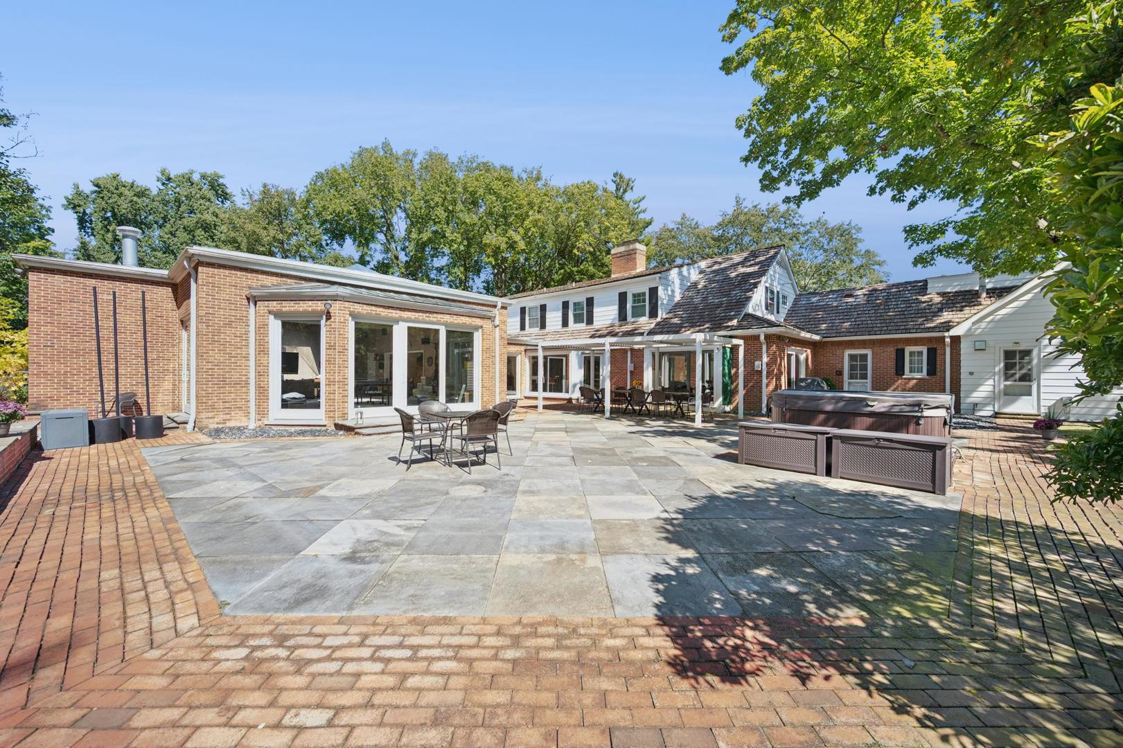 32 Meadowview Road Northfield, IL 60093 - Photo 53 of 69 a view of house with yard outdoor seating and covered with trees