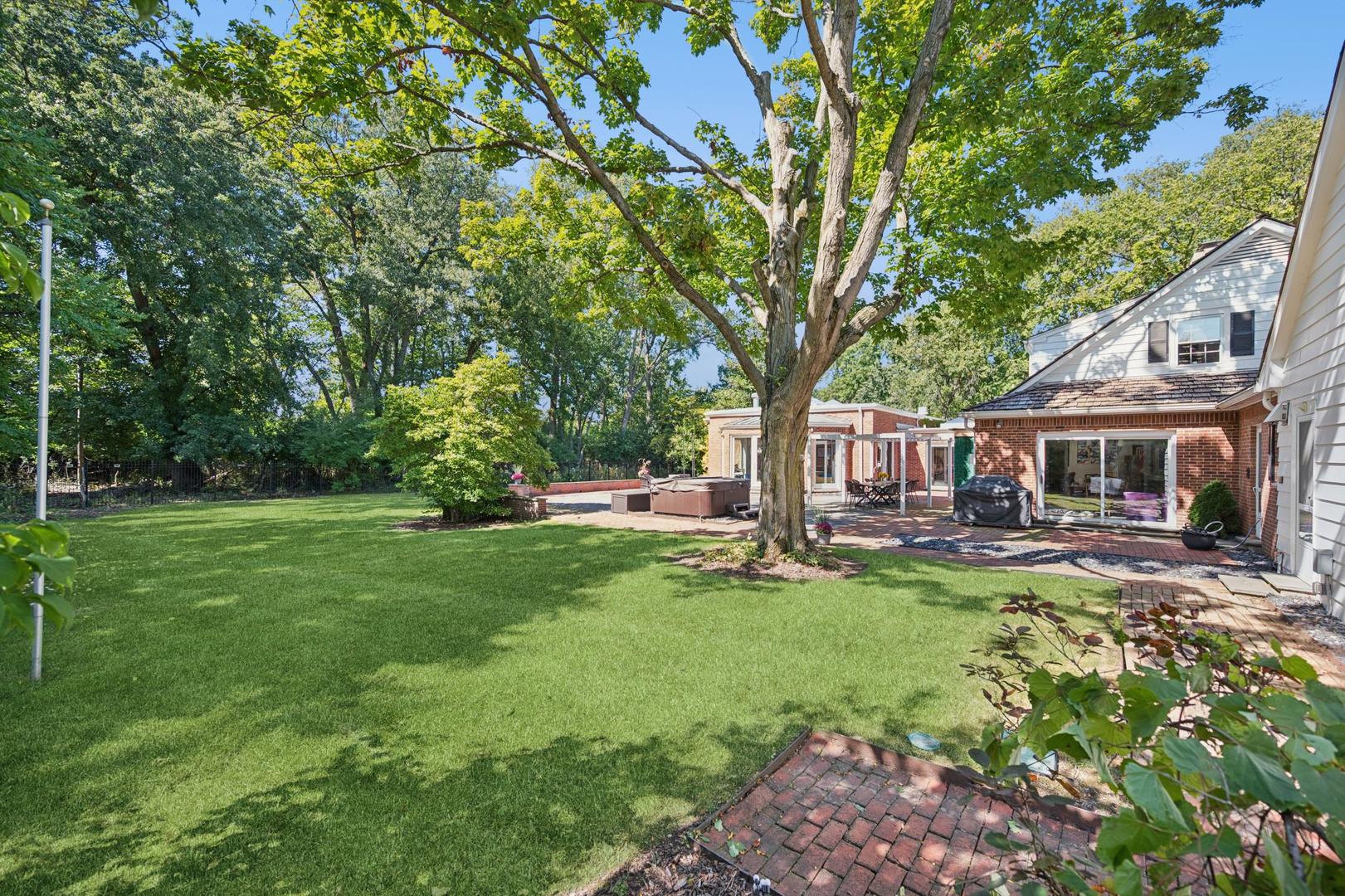 32 Meadowview Road Northfield, IL 60093 - Photo 58 of 69 a view of a house with backyard sitting area and garden