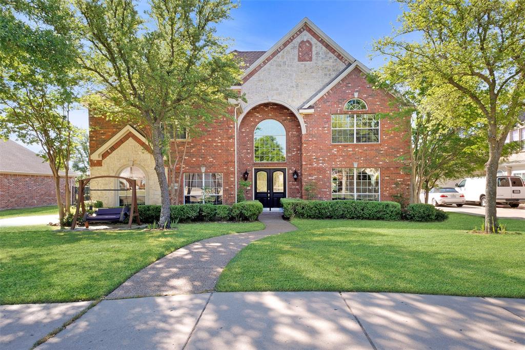 10414 Broadmoor Lane Rowlett, TX 75089 - Photo 2 of 38 Traditional-style house featuring brick siding, a front lawn, and french doors