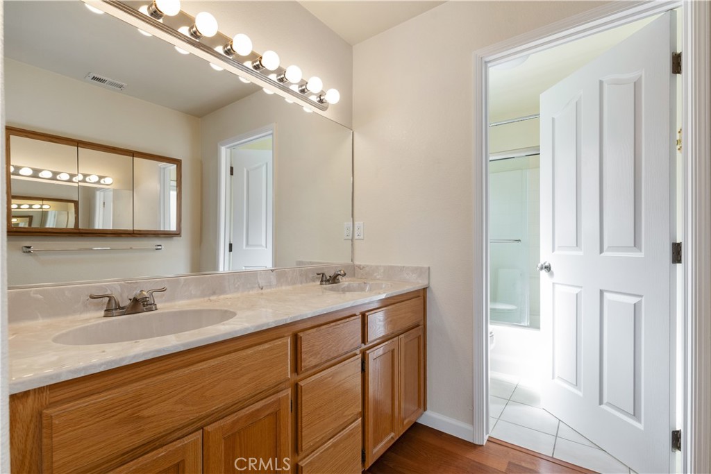 52 Sunnyside Way Templeton, CA 93465 - Photo 20 of 41 a bathroom with a sink double vanity and a mirror