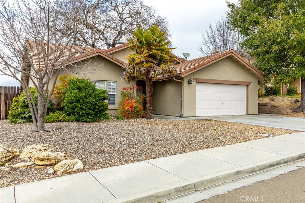 52 Sunnyside Way Templeton, CA 93465 - Photo 2 of 41 a front view of a house with a yard and garage