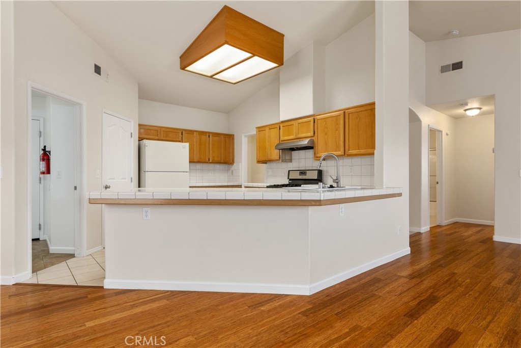 52 Sunnyside Way Templeton, CA 93465 - Photo 10 of 41 a view of kitchen with wooden floor and electronic appliances