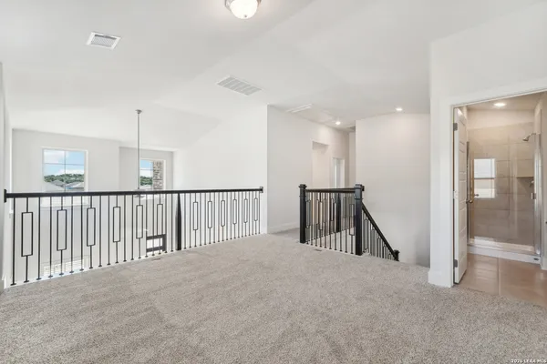 a view of a hallway with staircase