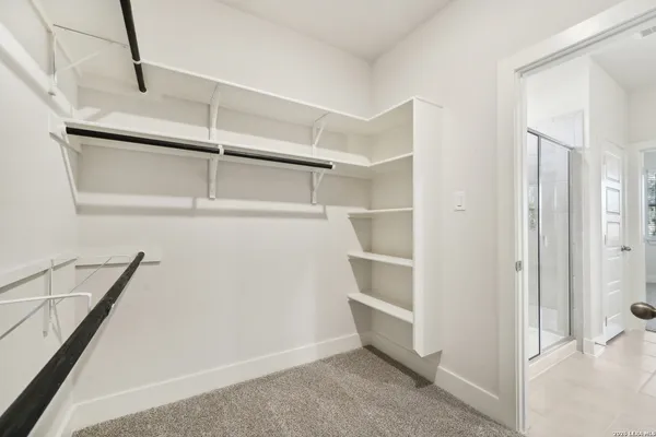 a view of an empty walk in closet