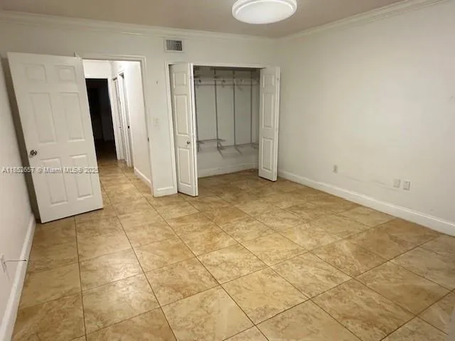 an empty room with a fireplace