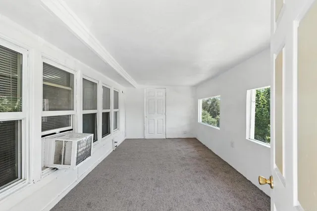 an empty room with windows