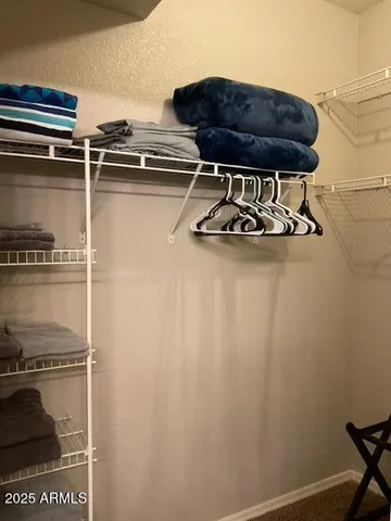a table with a stove and a wooden floor
