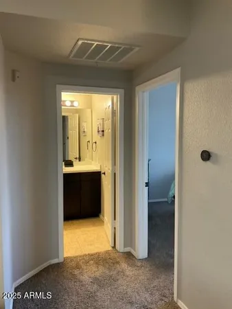 a view of walk in closet and bedroom