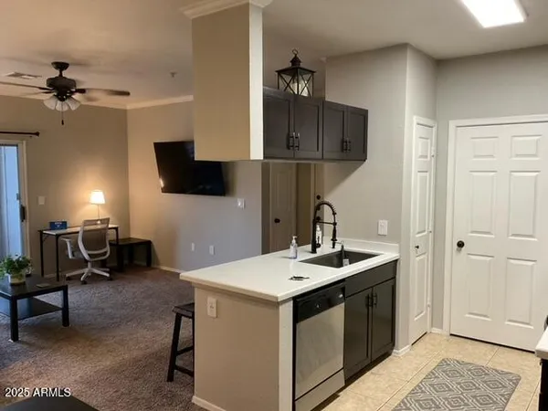 a kitchen with a sink and a refrigerator