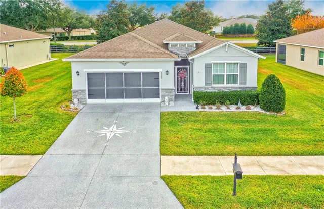 a view of a house with a yard