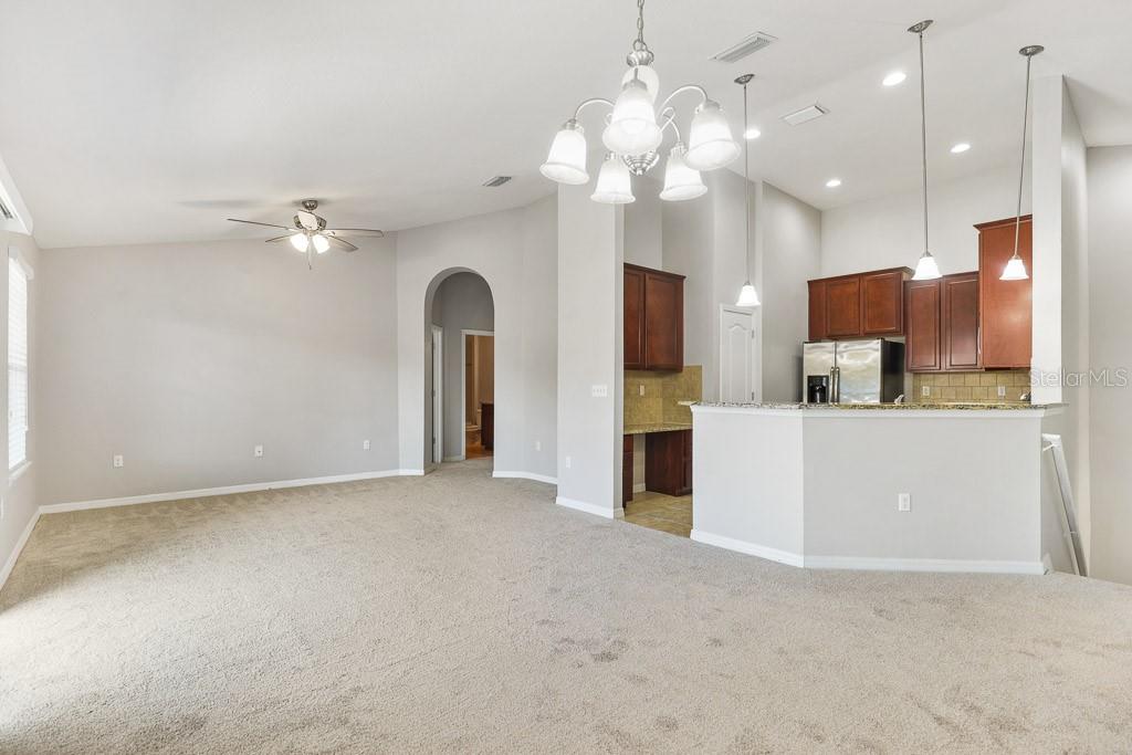 5738 Kingletsound Lithia, FL 33547 - Photo 6 of 32 a view of a kitchen with a sink and a large mirror