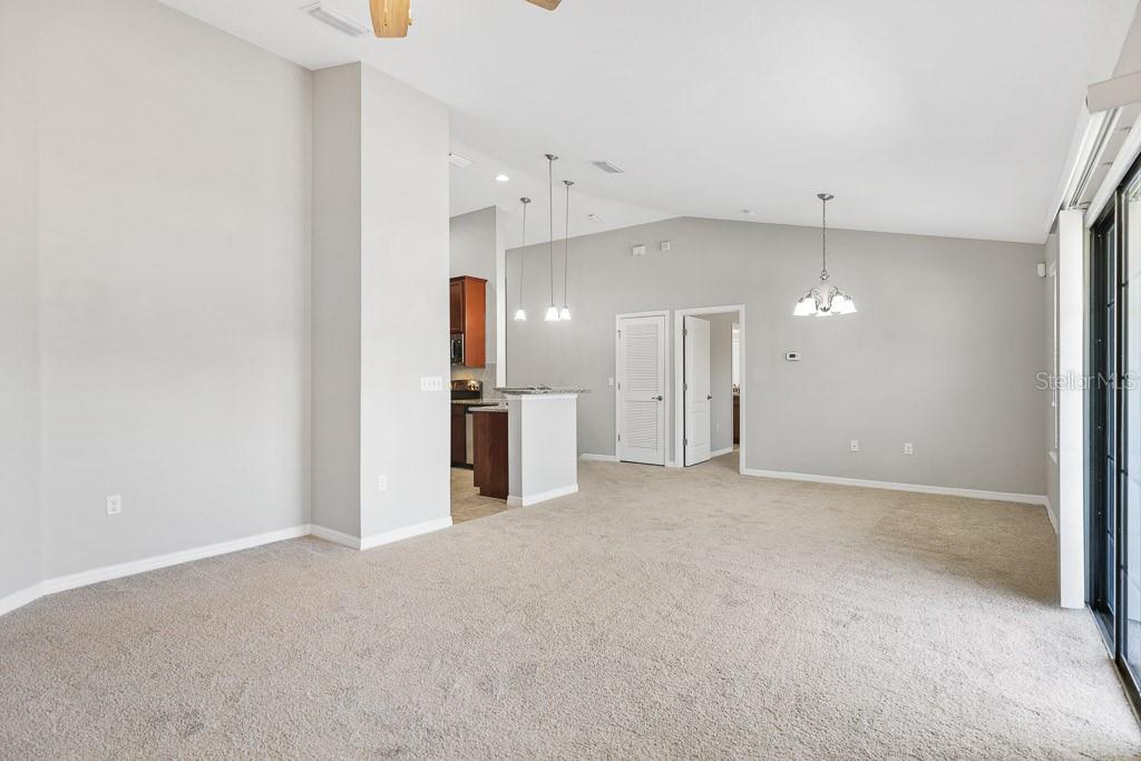 5738 Kingletsound Lithia, FL 33547 - Photo 7 of 32 a view of a kitchen with a refrigerator and a sink