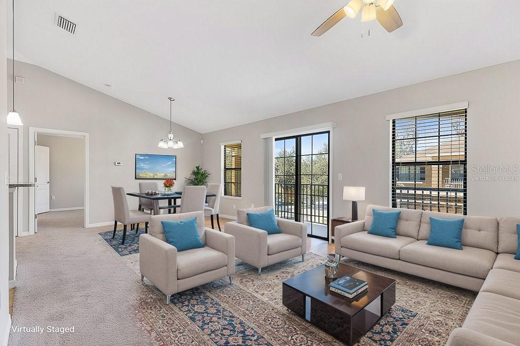 5738 Kingletsound Lithia, FL 33547 - Photo 8 of 32 a living room with furniture and a large window