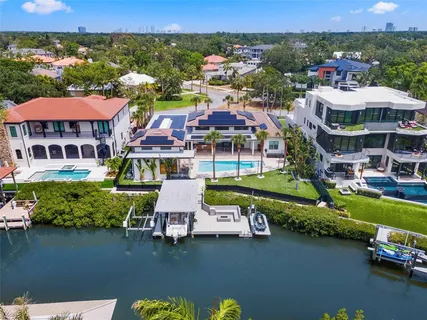 a bathroom with a granite countertop sink and a bathtub