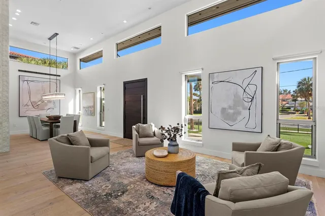 a large kitchen with a table and chairs in it