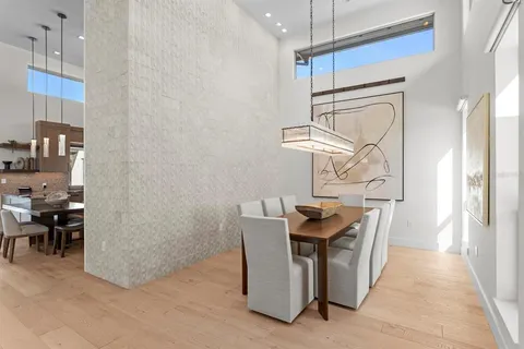 a bedroom with a bed and a painting