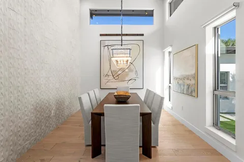 a bathroom with a granite countertop toilet sink and mirror