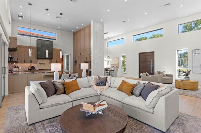 a bathroom with a granite countertop toilet sink and mirror