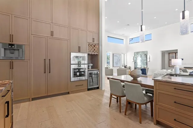 a bathroom with a granite countertop toilet sink and mirror