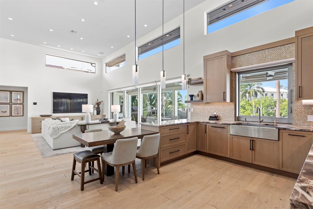 5129 West Neptune Way Tampa, FL 33609 - Photo 27 of 77 a large kitchen with a table and chairs in it