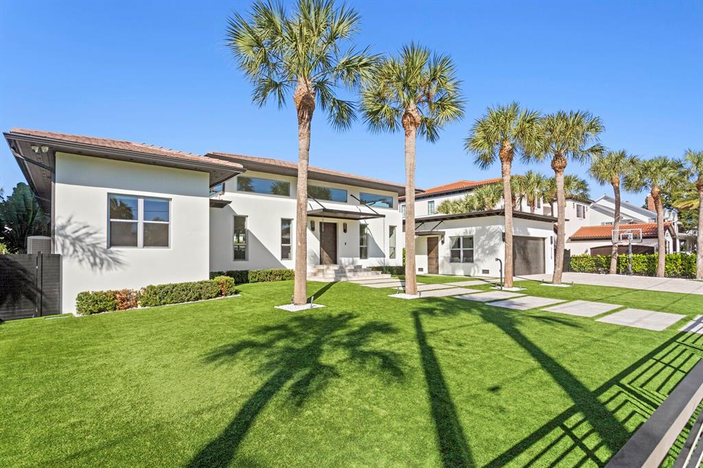 5129 West Neptune Way Tampa, FL 33609 - Photo 3 of 77 a view of a house with a yard