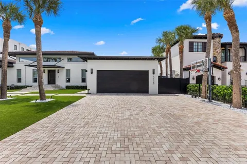 an aerial view of residential houses with outdoor space and street view