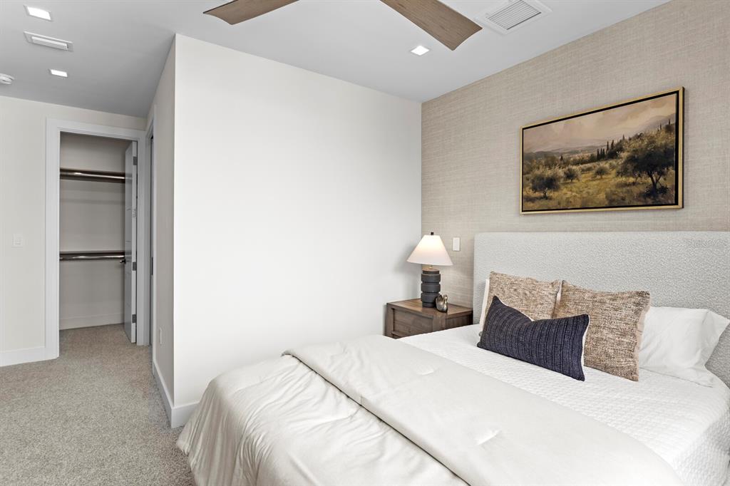 5129 West Neptune Way Tampa, FL 33609 - Photo 46 of 77 a bedroom with a bed and a painting