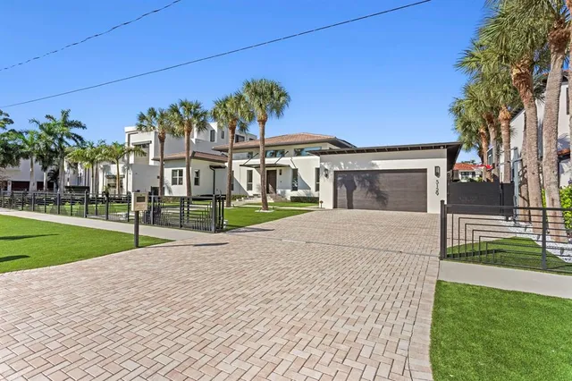 a view of a house with a backyard porch and sitting area