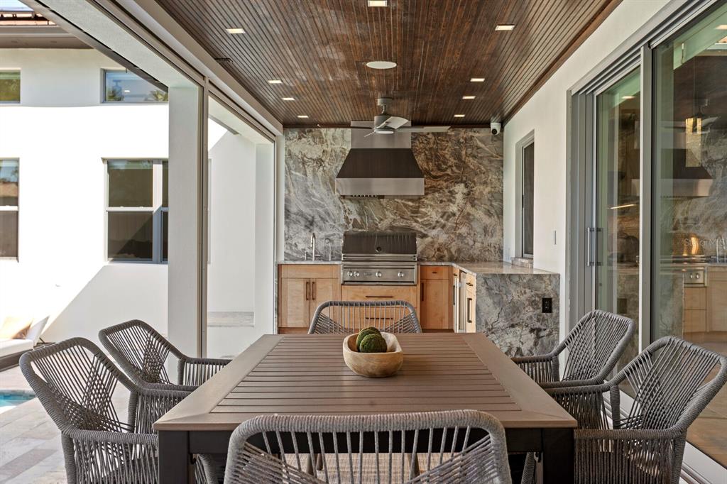 5129 West Neptune Way Tampa, FL 33609 - Photo 58 of 77 a view of a dining room with furniture