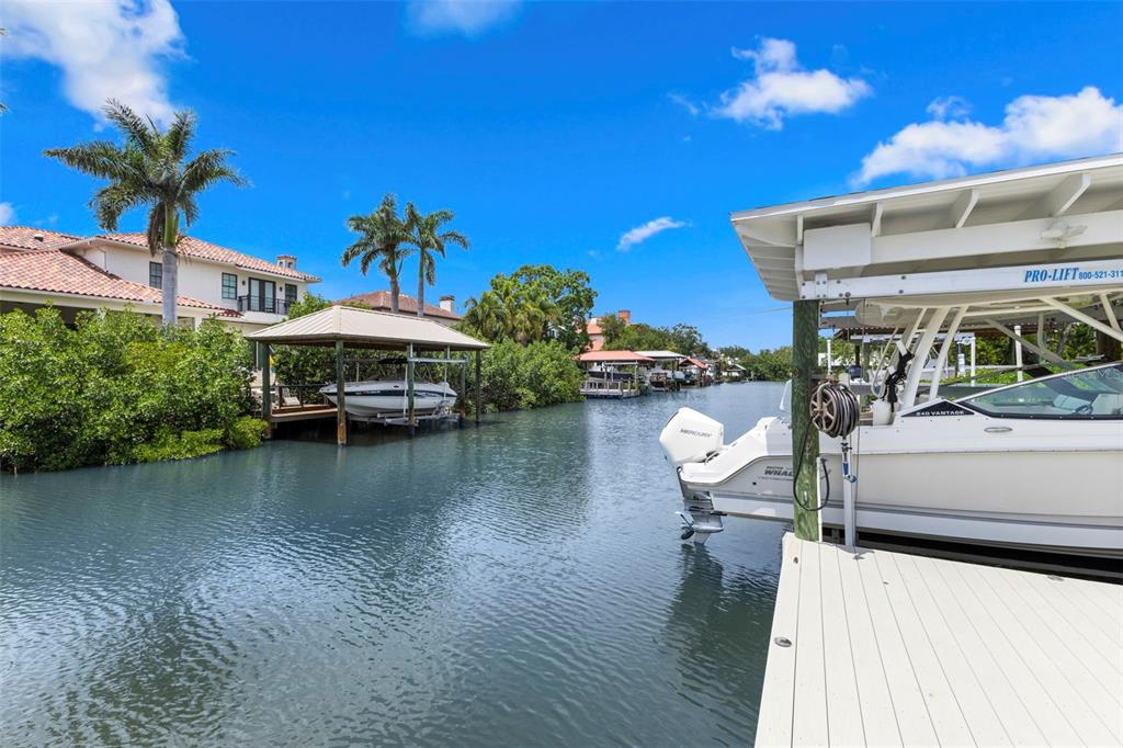 5129 West Neptune Way Tampa, FL 33609 - Photo 69 of 77 a view of a lake with a house in the background