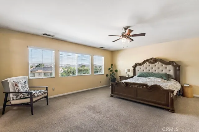 a living room with furniture and a large window with outer view