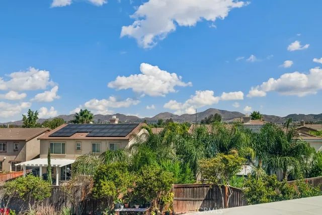 a view of a house with a yard and garden
