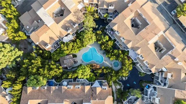 an aerial view of a house with a yard and garden