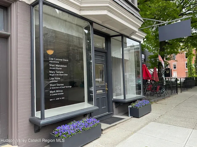a view of path along with retail shop and buildings