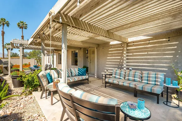 a view of a patio with swimming pool