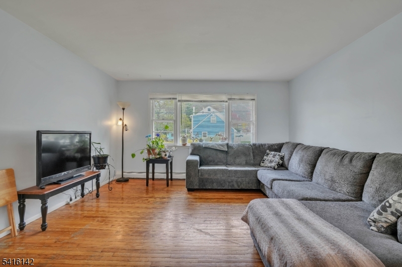 14 Woods Edge Road Stanhope, NJ 07874 - Photo 12 of 25 a living room with furniture and a flat screen tv