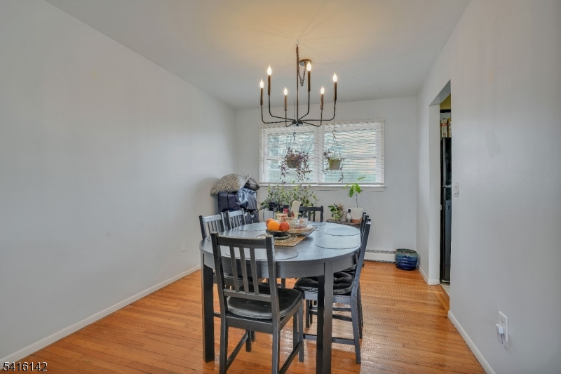 14 Woods Edge Road Stanhope, NJ 07874 - Photo 13 of 25 a view of a dining room with furniture and wooden floor