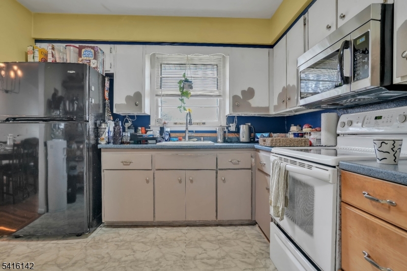 14 Woods Edge Road Stanhope, NJ 07874 - Photo 14 of 25 a kitchen with stainless steel appliances granite countertop a refrigerator sink and cabinets