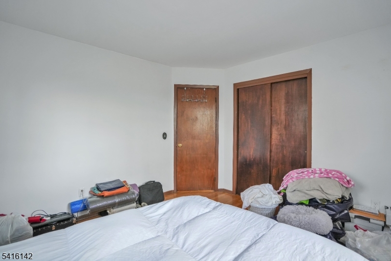 14 Woods Edge Road Stanhope, NJ 07874 - Photo 19 of 25 a bedroom with a bed and wooden floor