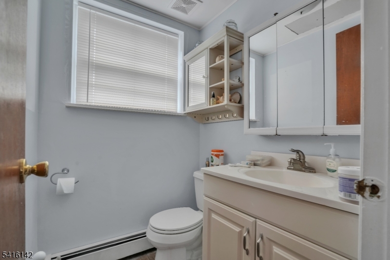 14 Woods Edge Road Stanhope, NJ 07874 - Photo 25 of 25 a bathroom with a sink a toilet and a mirror