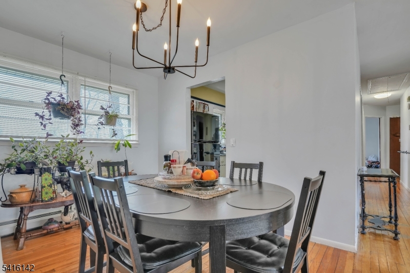 14 Woods Edge Road Stanhope, NJ 07874 - Photo 5 of 25 a view of a dining room with furniture wooden floor and chandelier