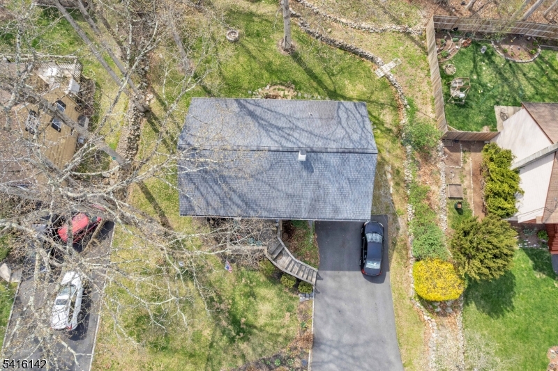 14 Woods Edge Road Stanhope, NJ 07874 - Photo 7 of 25 a aerial view of a house with a yard and large tree