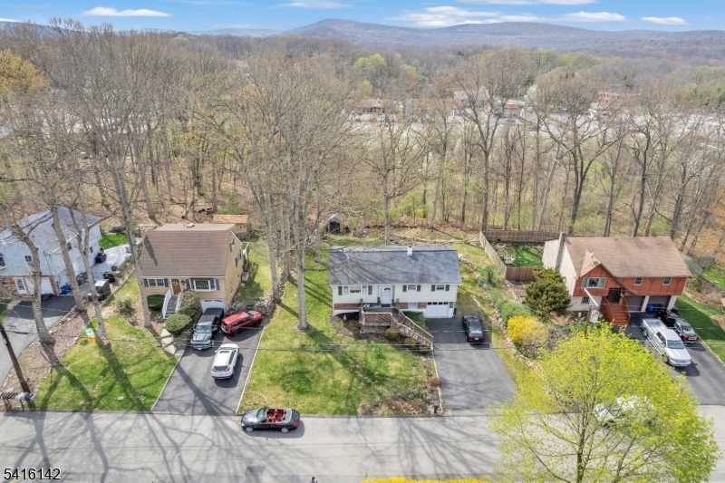 14 Woods Edge Road Stanhope, NJ 07874 - Photo 8 of 25 a view of a patio with table and chairs under an umbrella