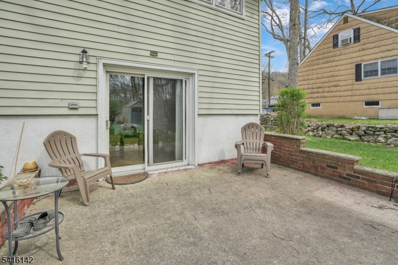 14 Woods Edge Road Stanhope, NJ 07874 - Photo 9 of 25 a lawn chairs and a table in a patio