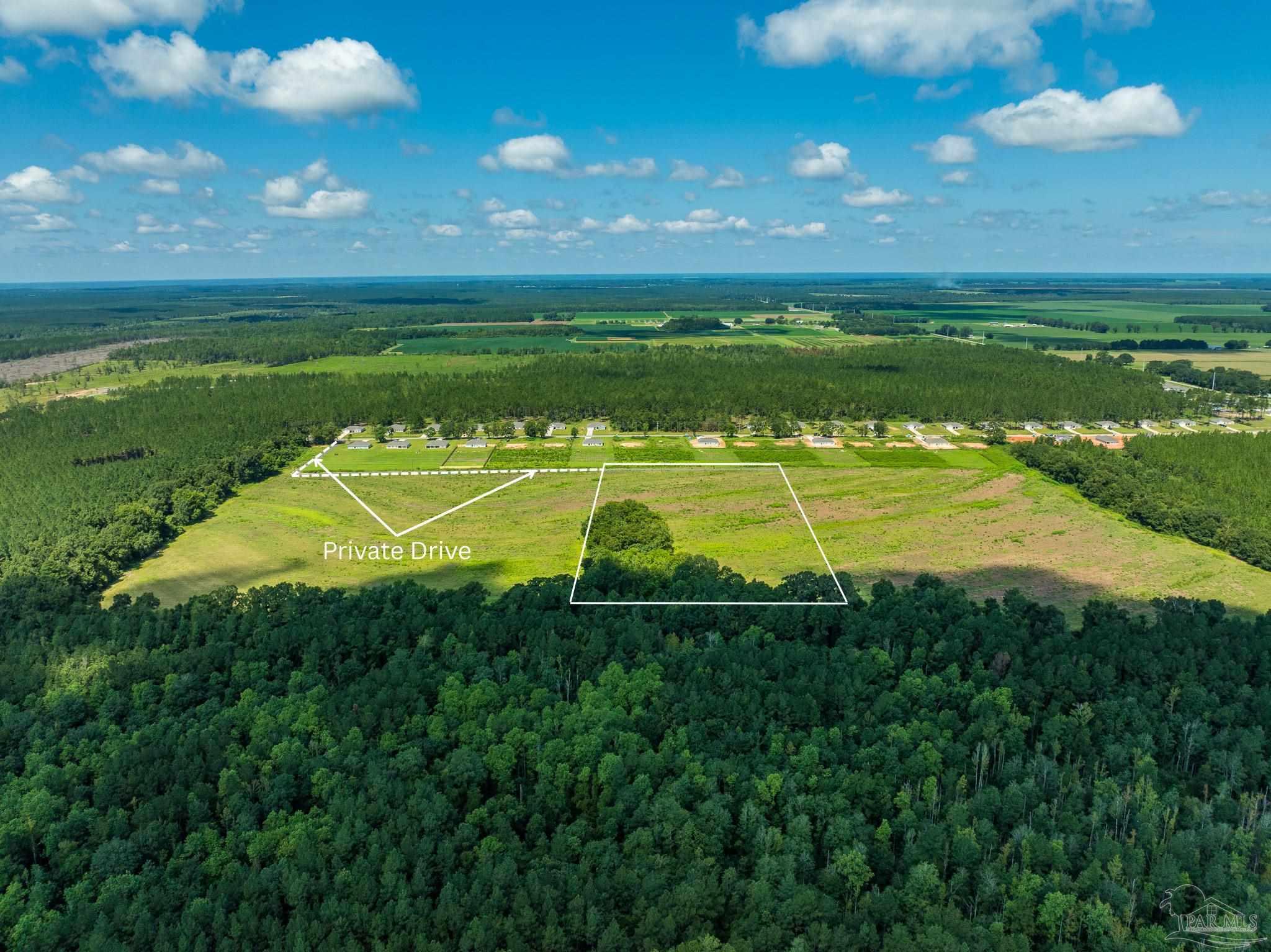Lot 2 Three Hollow Road Jay, FL 32565 - Photo 4 of 16 a view of a swimming pool with an outdoor space and seating area