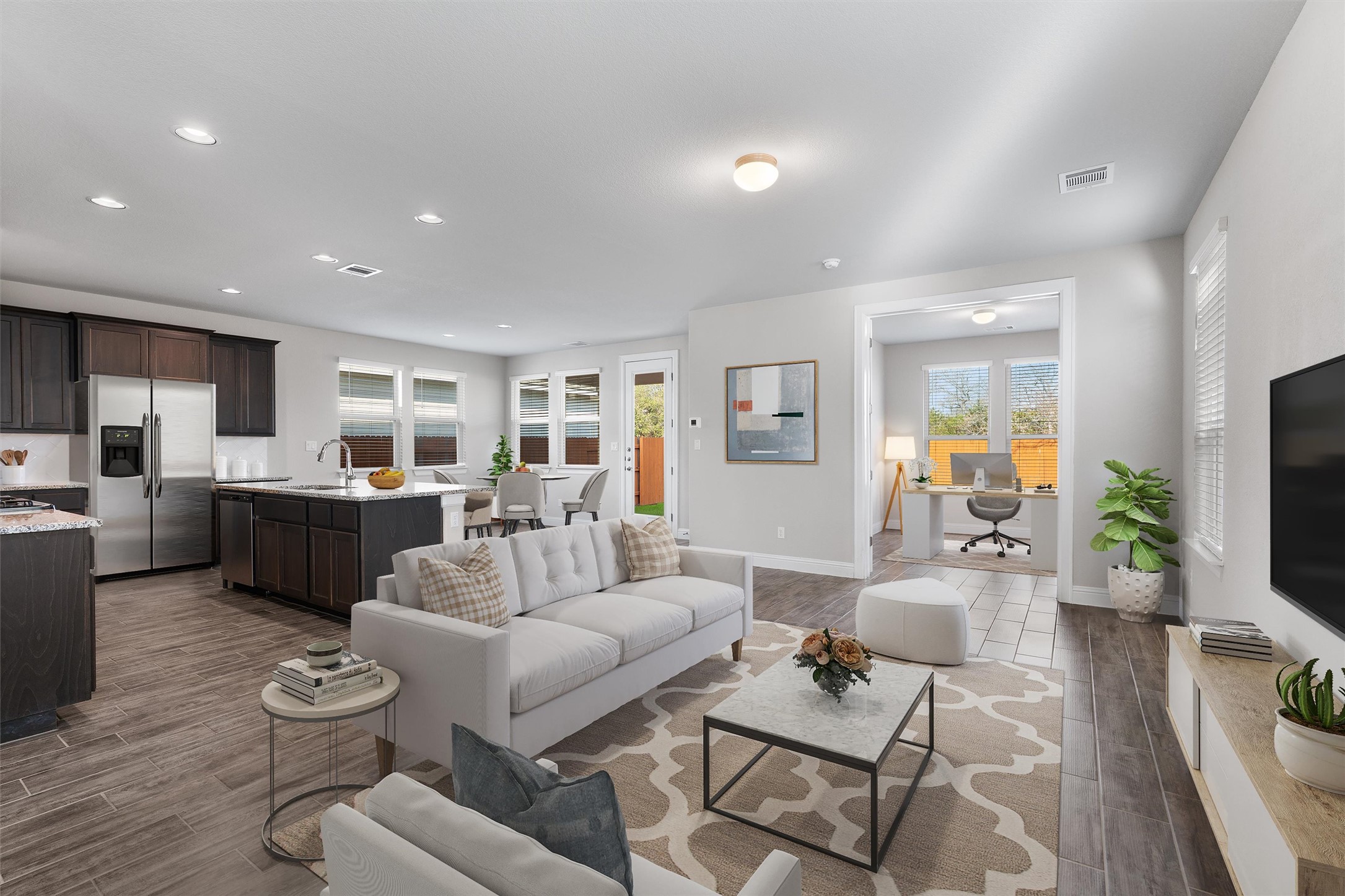Open concept floor plan, private office with french doors off of living room. AI generated staging.