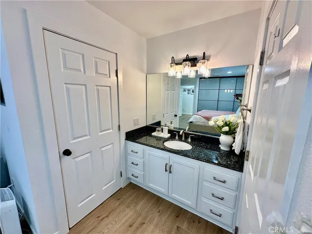 a bathroom with a double vanity sink and mirror