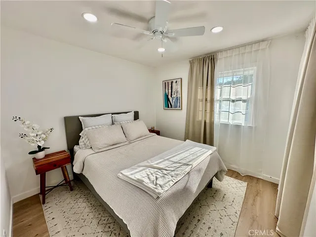 a bedroom with a bed and a table