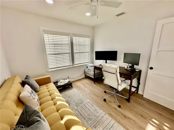 a bedroom with a workspace