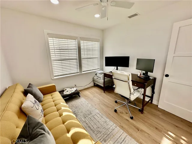 a bedroom with a workspace